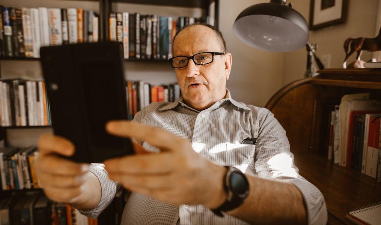 Elderly Man Using a Digital Tablet