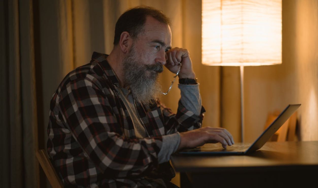 A Man Using a Laptop