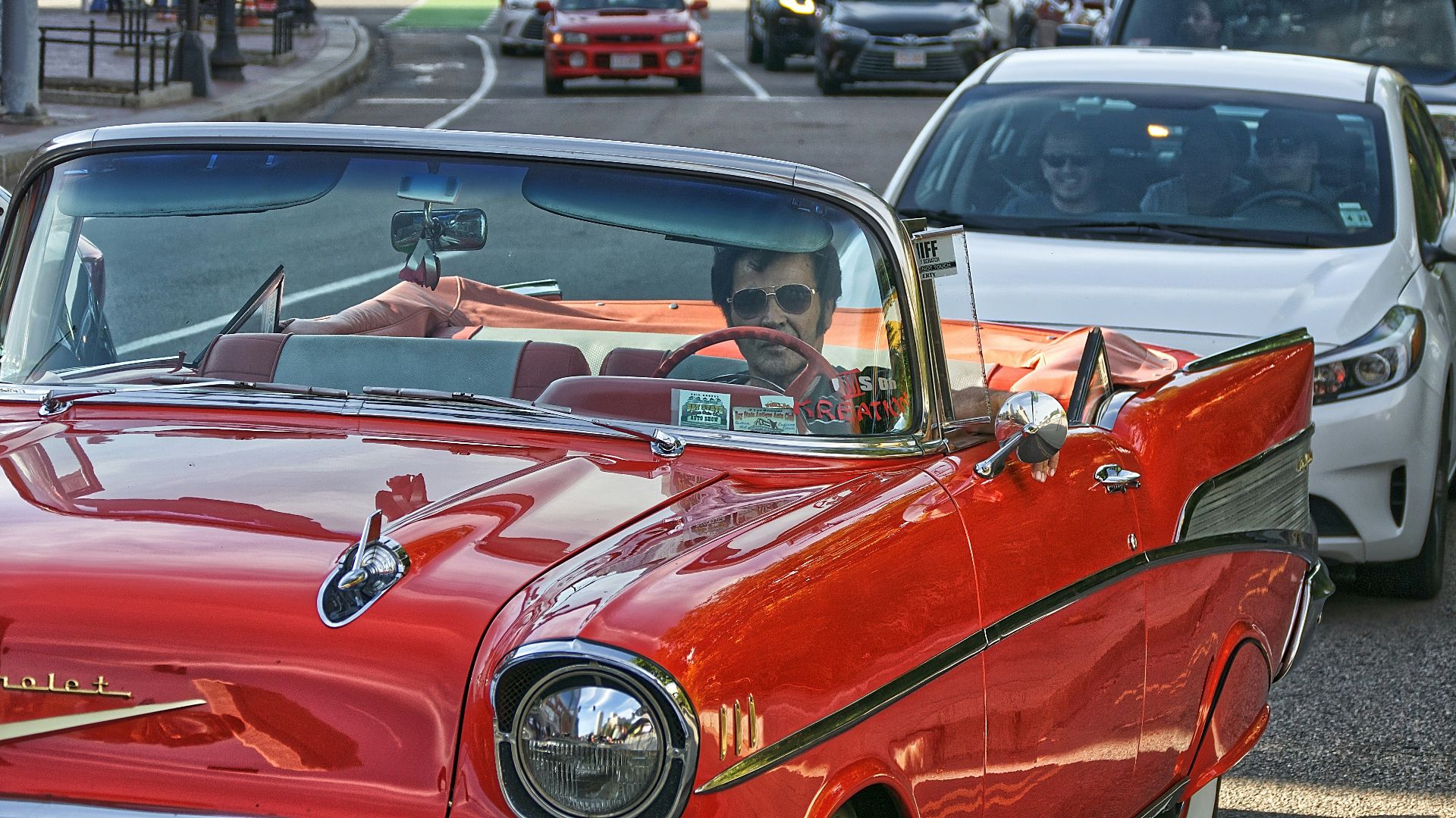 red car parked on parking lot during daytime