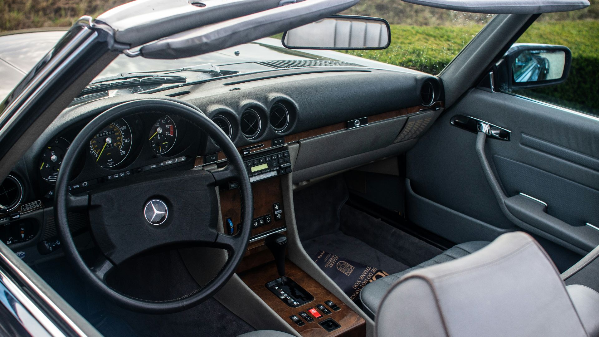 The interior of a sports car with the dashboard up