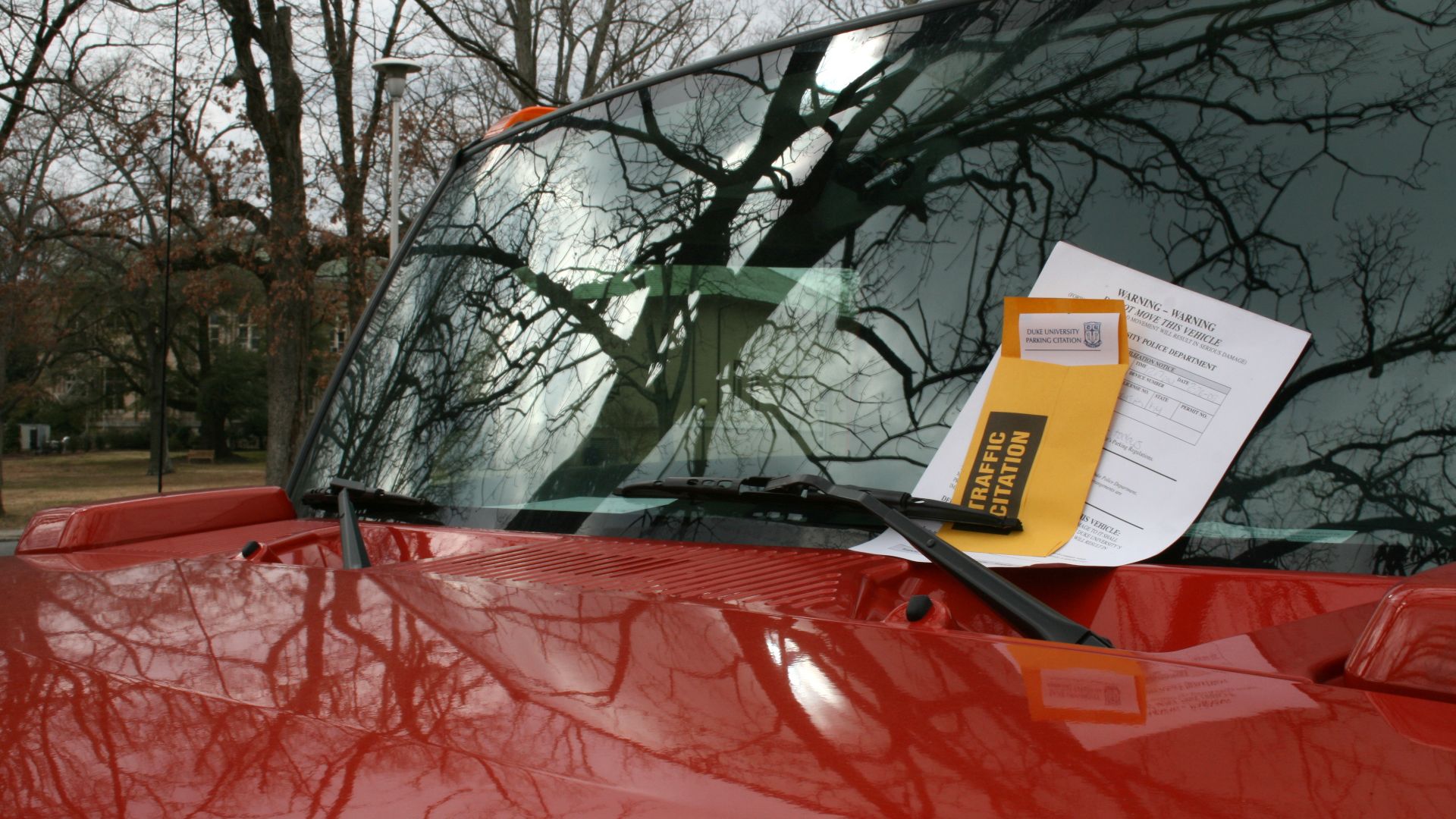 A red Hummer with a parking ticket at Duke University East Campus in Durham, North Carolina.