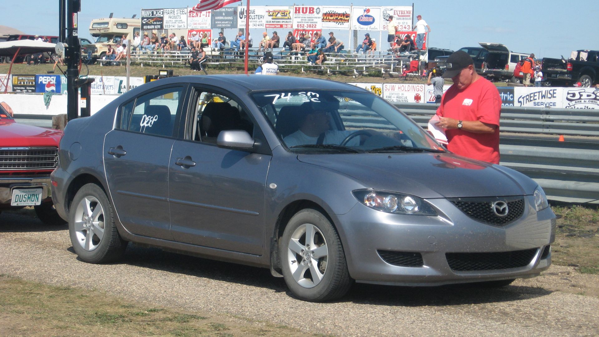 Street-legal front-drive car on the return road at SIR, drag strip 13km from Saskatoon, SK, shot 23 Aug 2008. Note the tag announcing deep staging.
