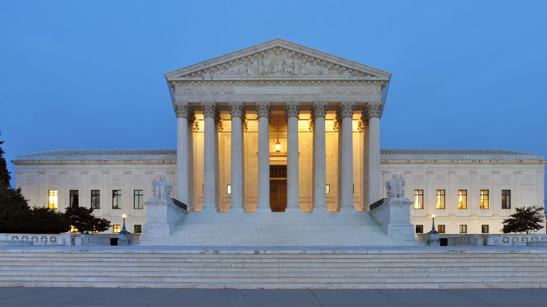 Panorama of the west facade of United States Supreme Court Building at dusk in Washington, D.C., United States of America.