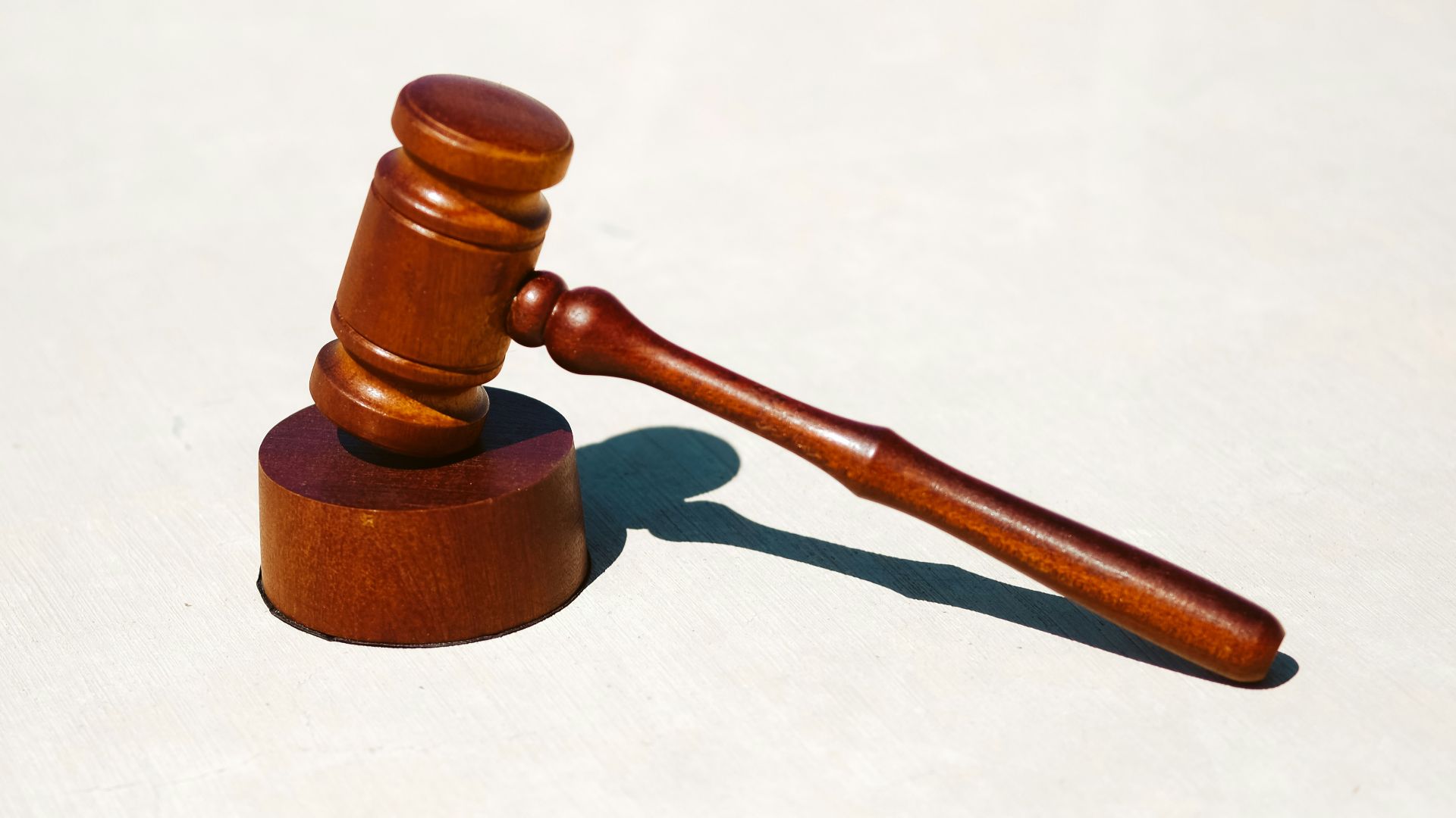 brown wooden tool on white surface