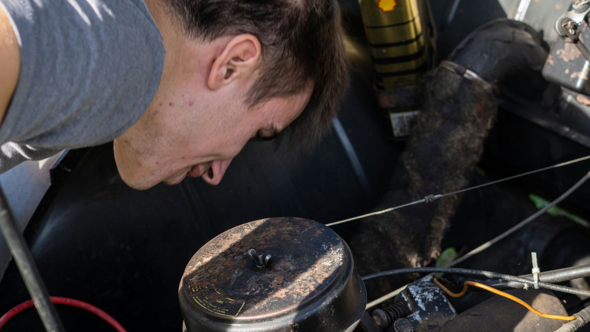 a man working on a car engine