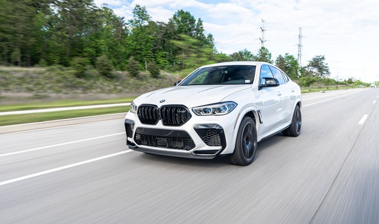 Luxury car driving through paved road