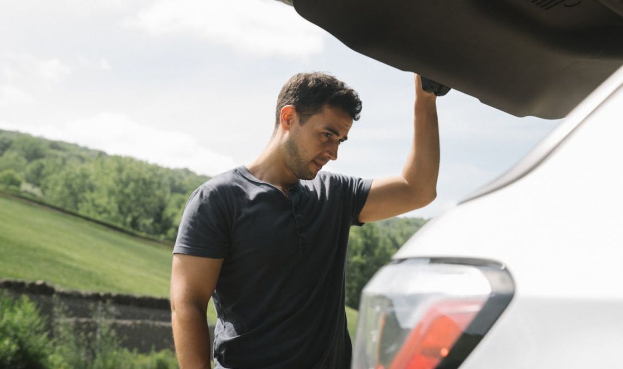 Man Looking From the Car Trunk