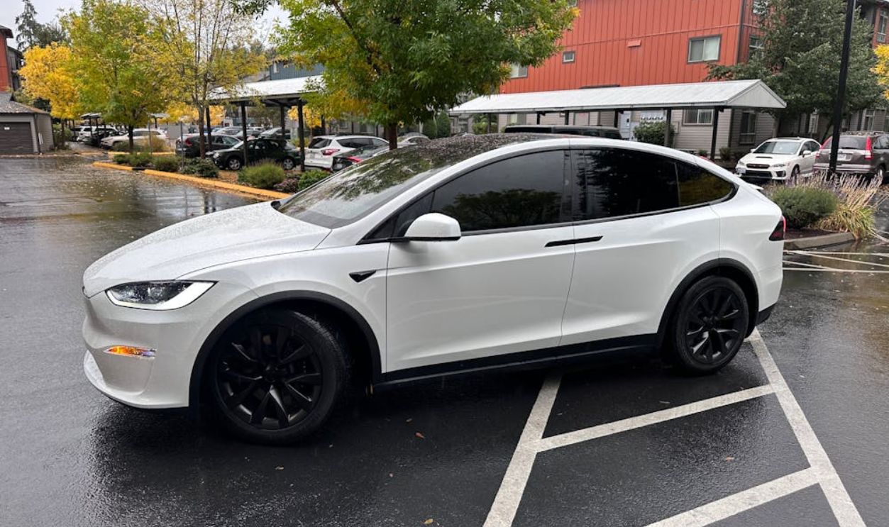 White Electric SUV Parked on Rainy Day in Seattle