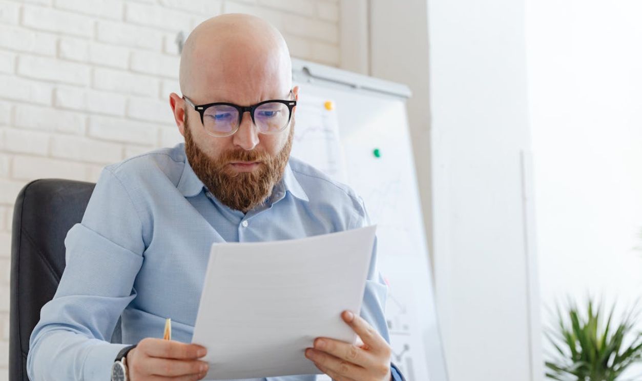 A Man Looking at Documents