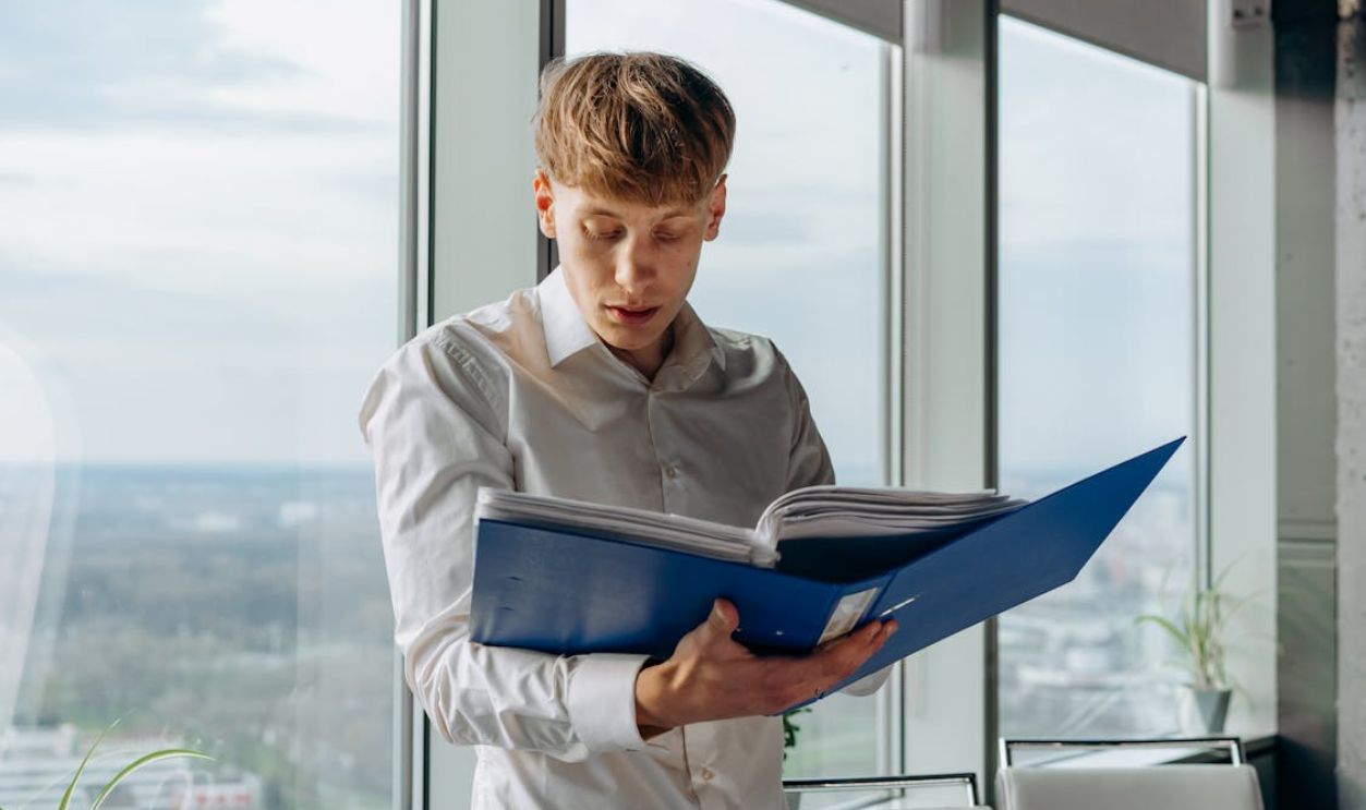 A Businessman Reading Files in the Office