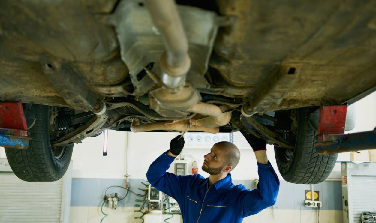 A Man Repairing a Vehicle