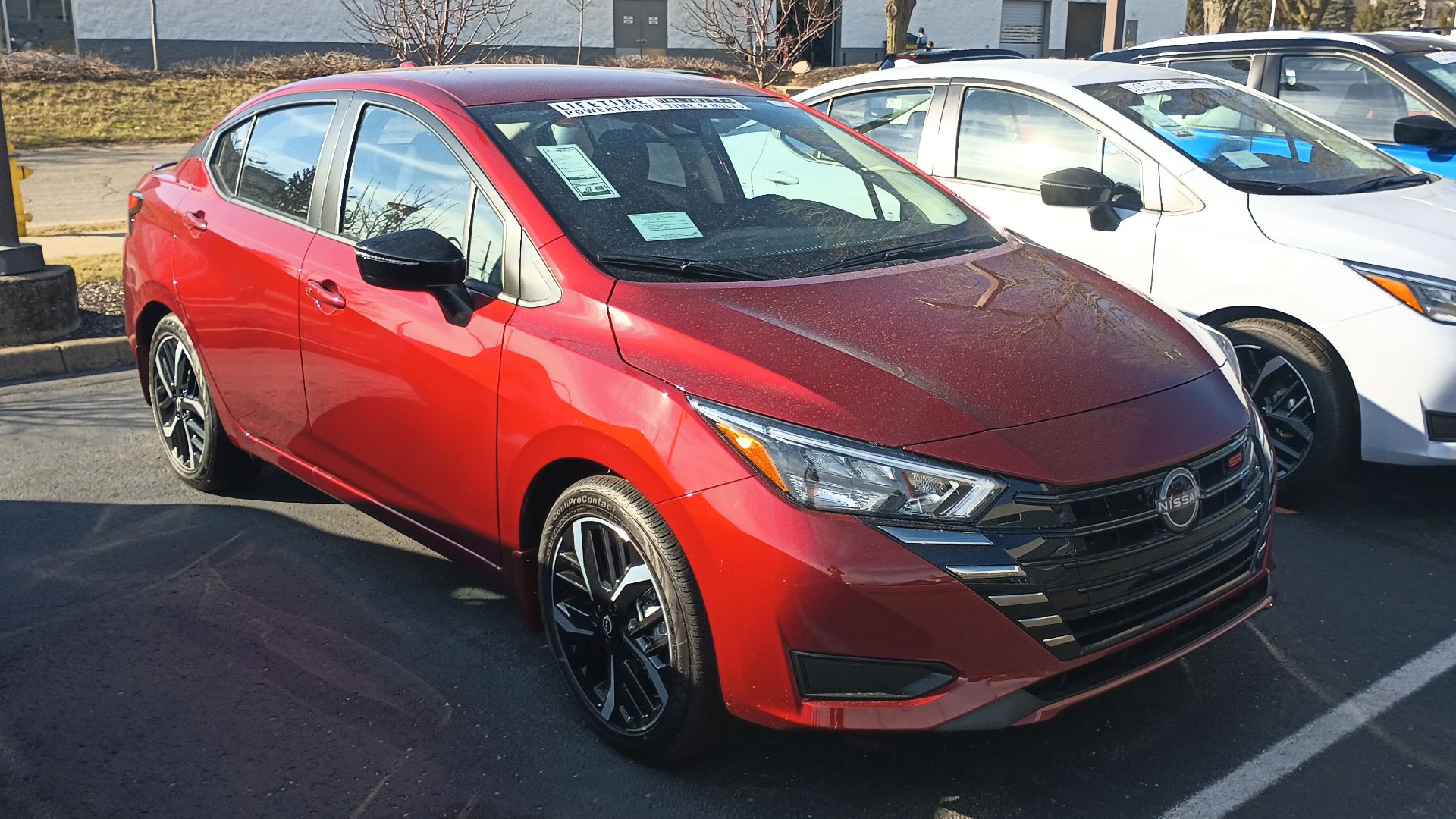 Front view of a 2024 Nissan Versa SR subcompact car.