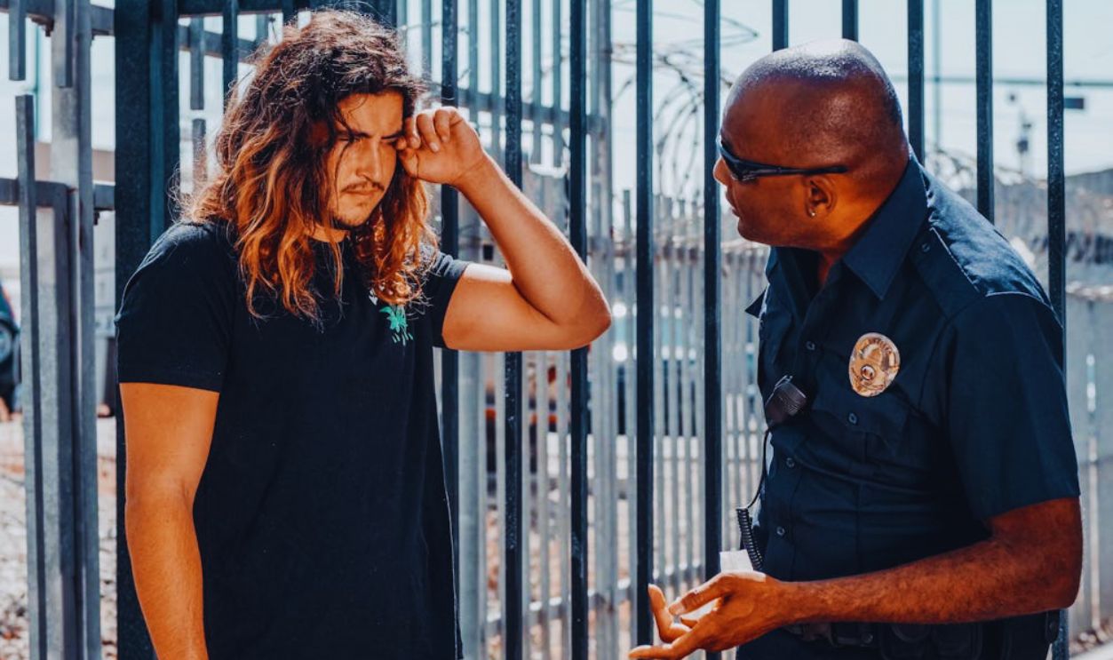 An Officer Talking to a Man