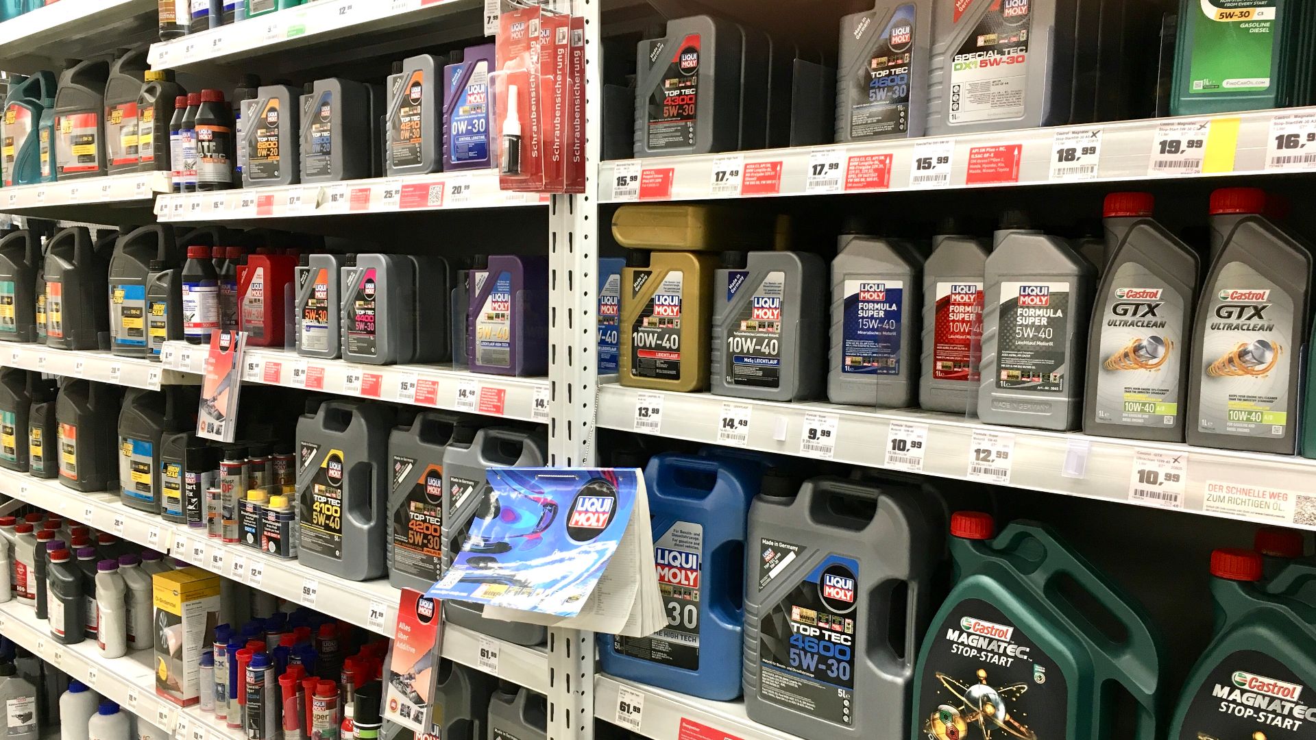 Motor oil for cars and motorcycles from various producers in German hardware store