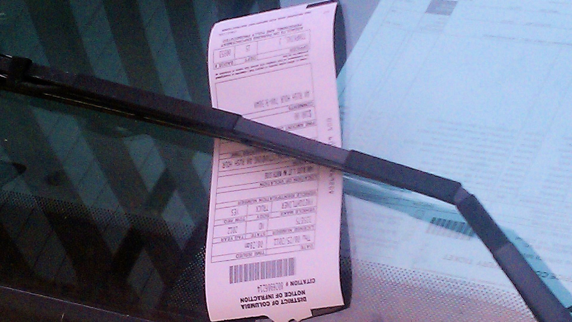 Parking ticket on the window of a commercial vehicle illegally parked in Washington, D.C., in the United States.