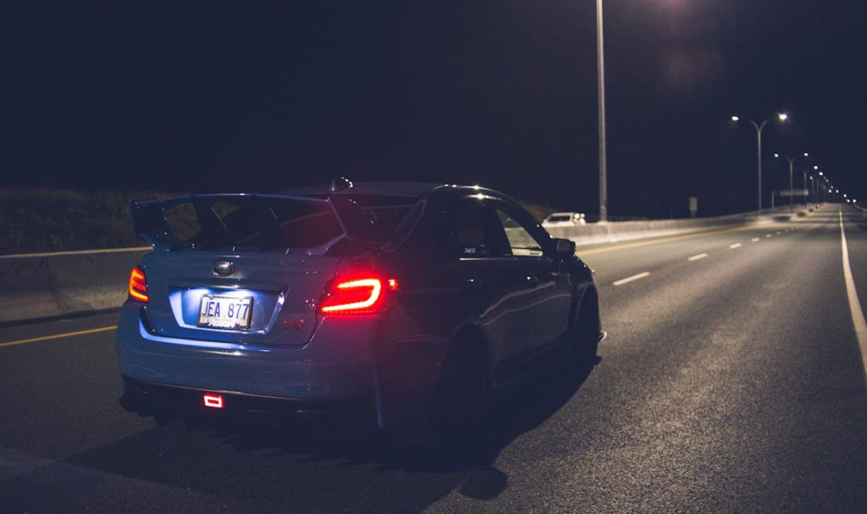 Modern shiny car with luminous taillights