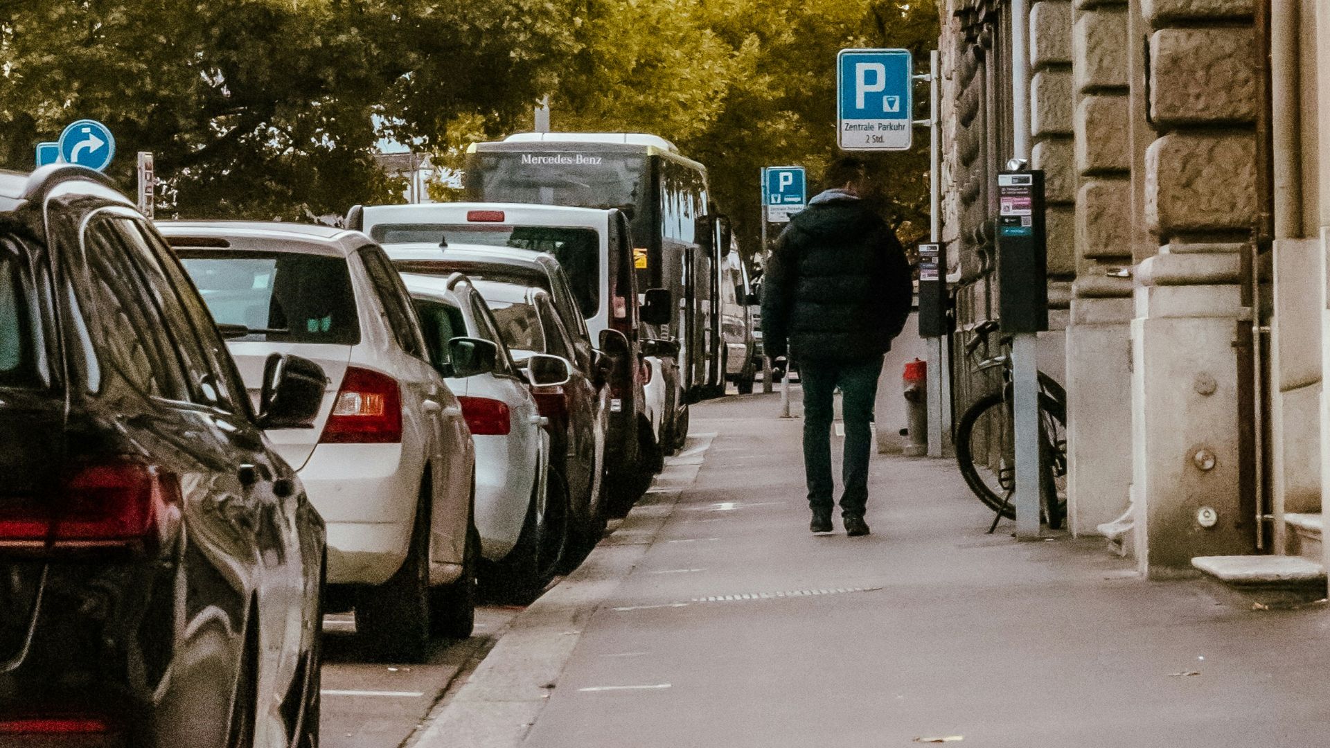 a person walking down a sidewalk
