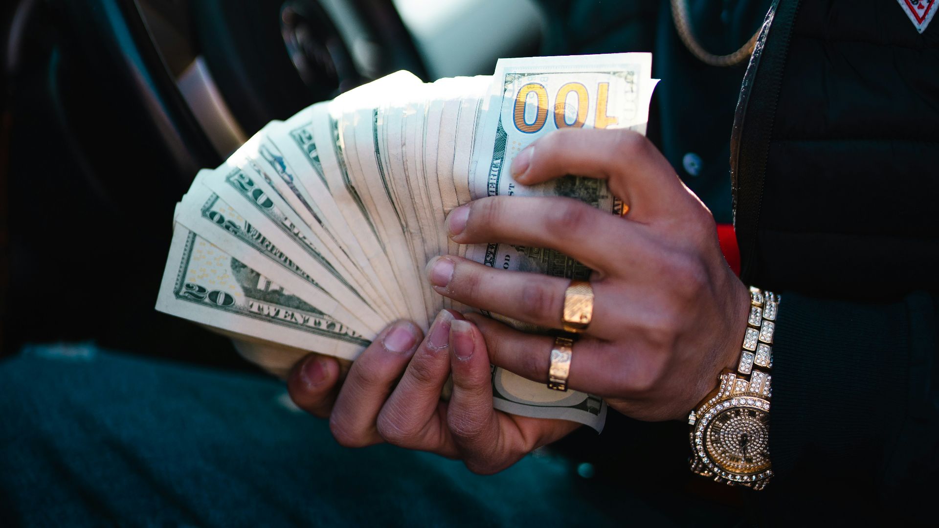man in blue dress shirt holding white ceramic mug