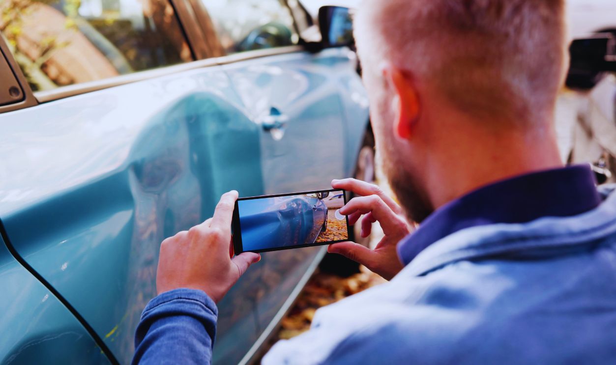 Shutterstock-2697049123, Insurance Investigator Captures Evidence Of Car Accident