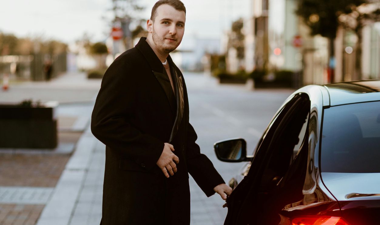 Elegant Man Getting Into a Car