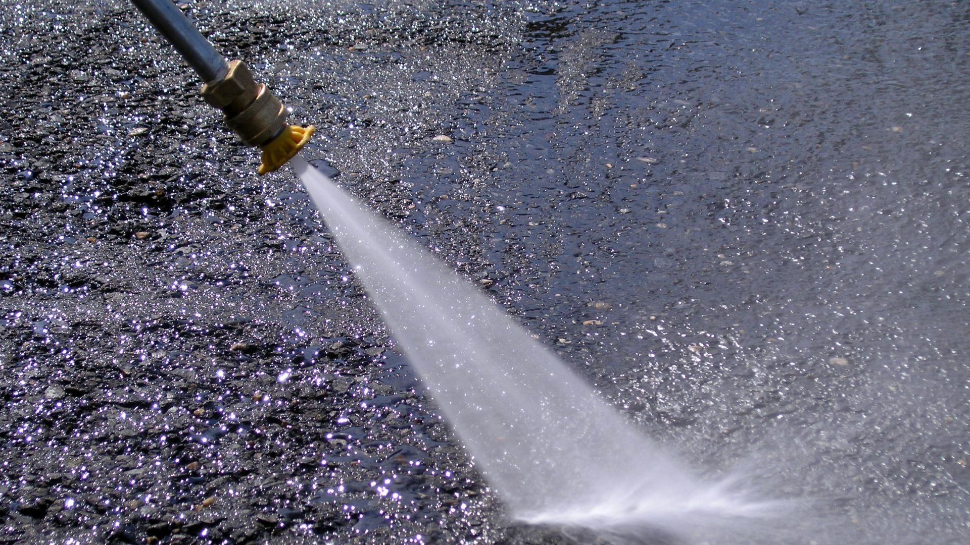 A Honda GX160 5.5 HP. pressure washer in action.