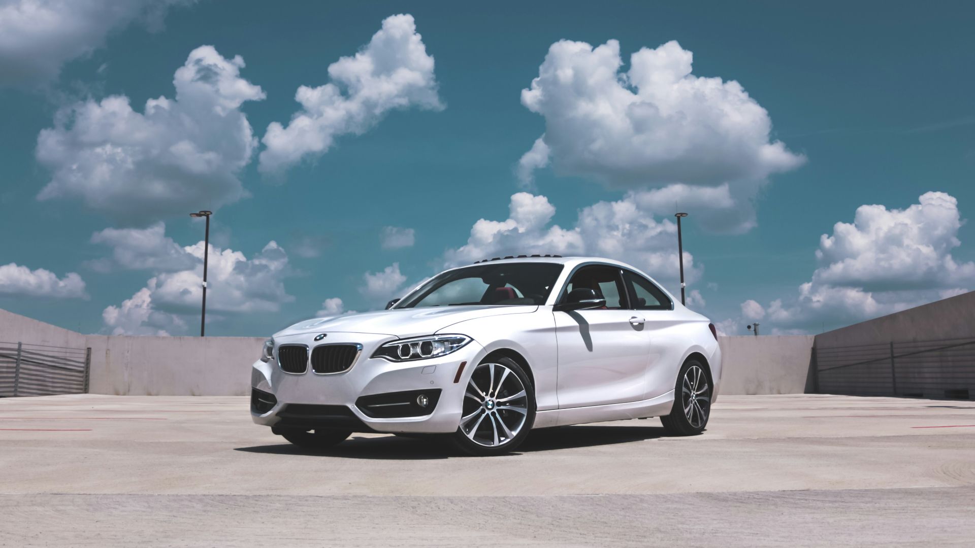 parked white BMW coupe