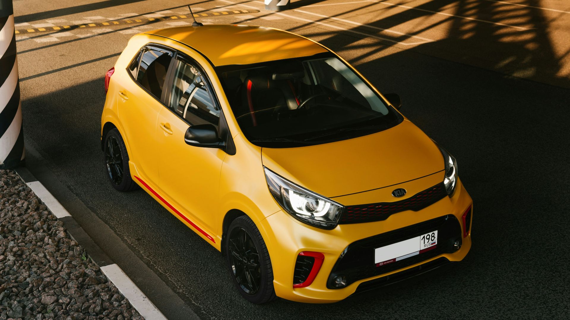 yellow sedan on pedestrian lane during night time