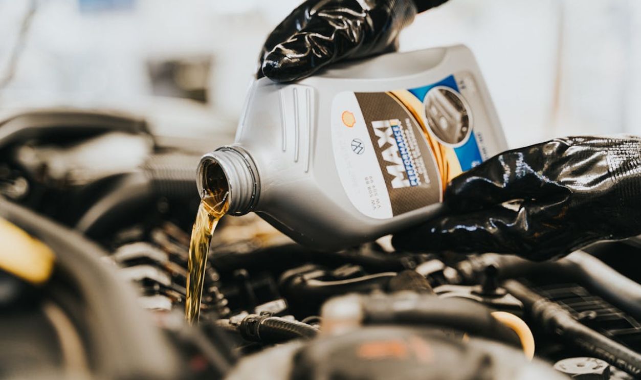 Close up of Pouring Oil to Engine