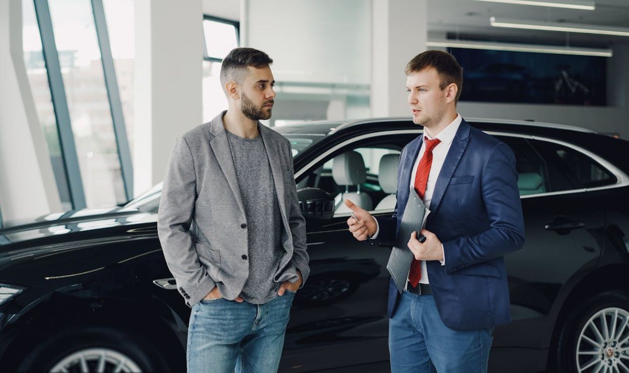 mechanic talking to customer