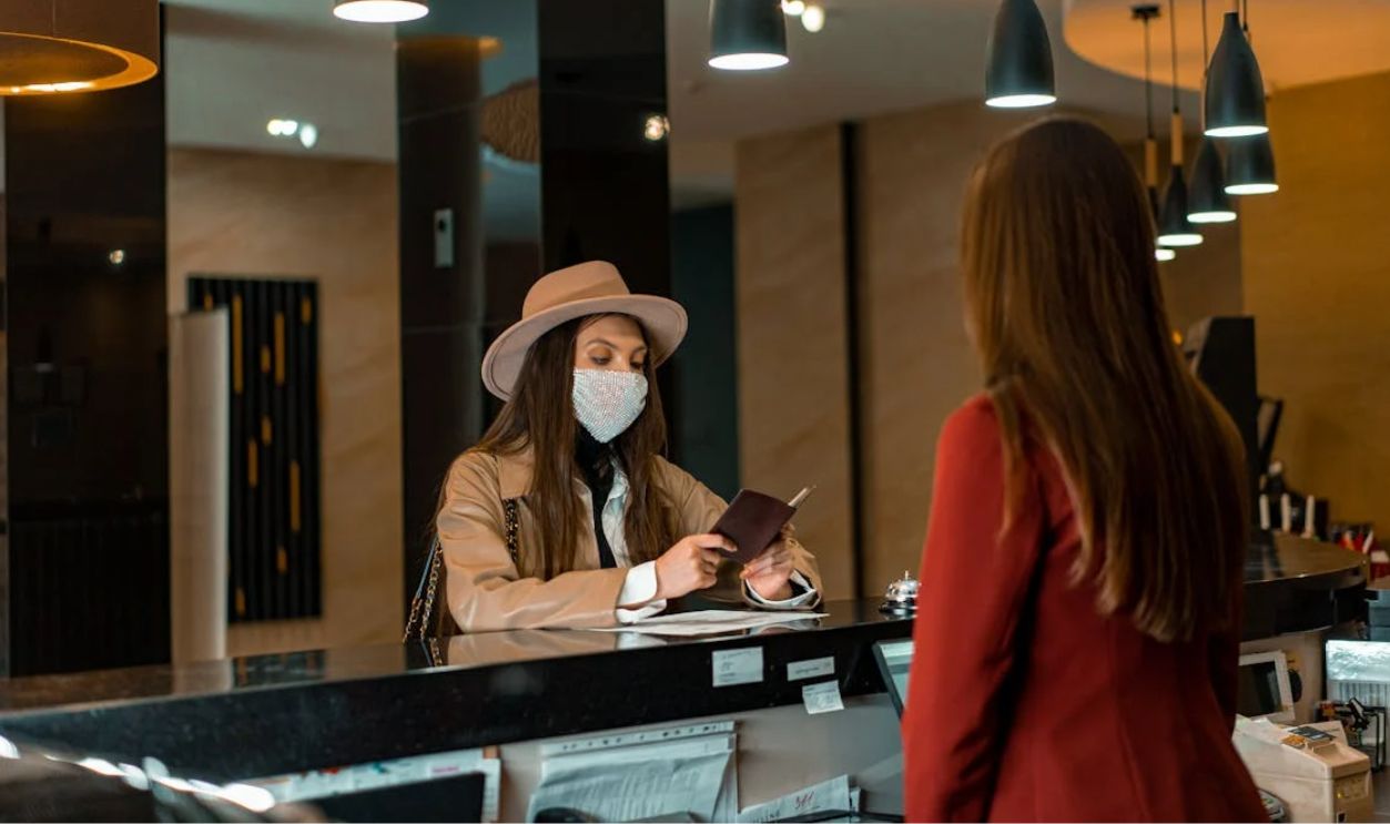 A Woman Standing at the Counter