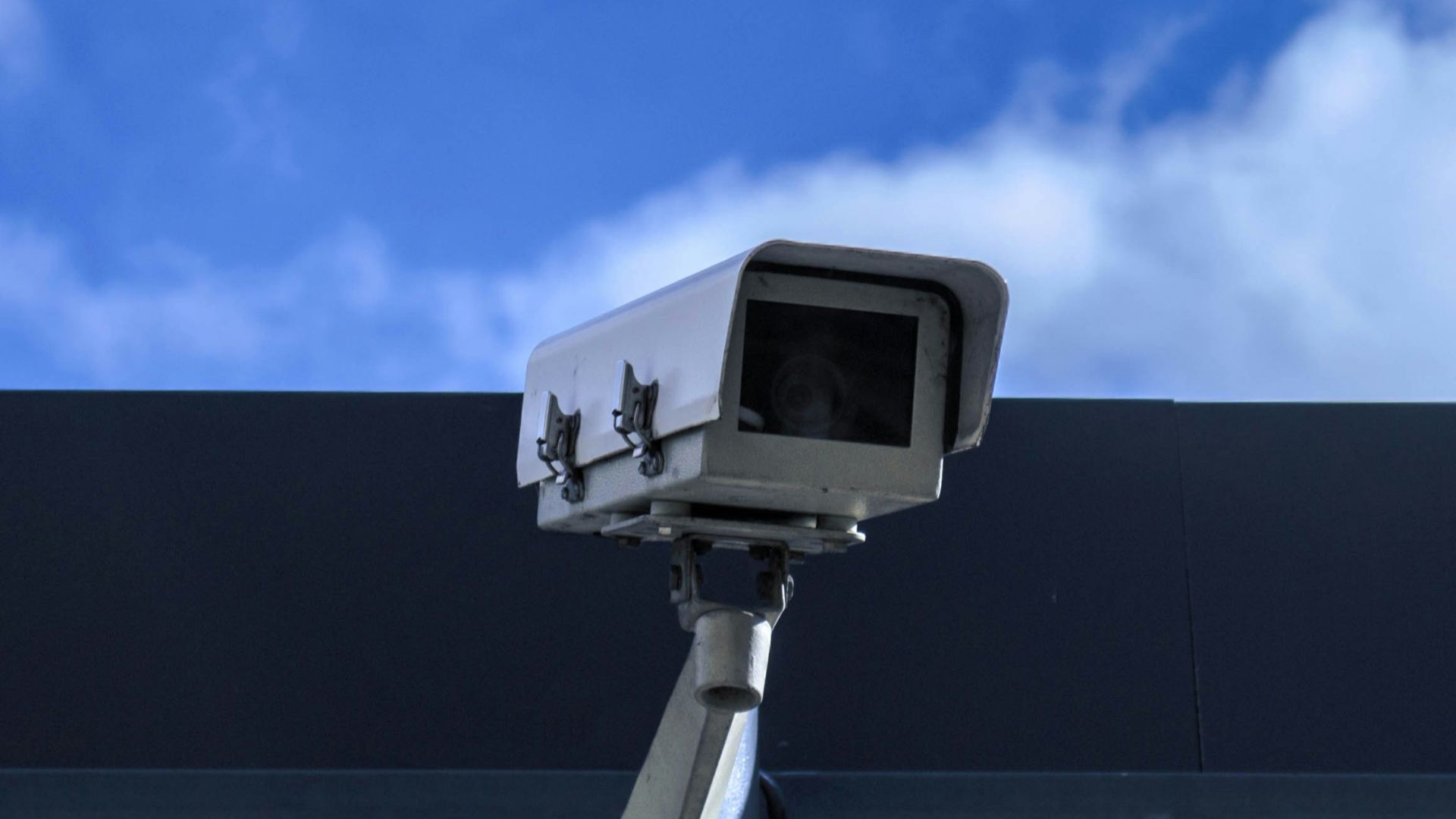 white security camera at daytime