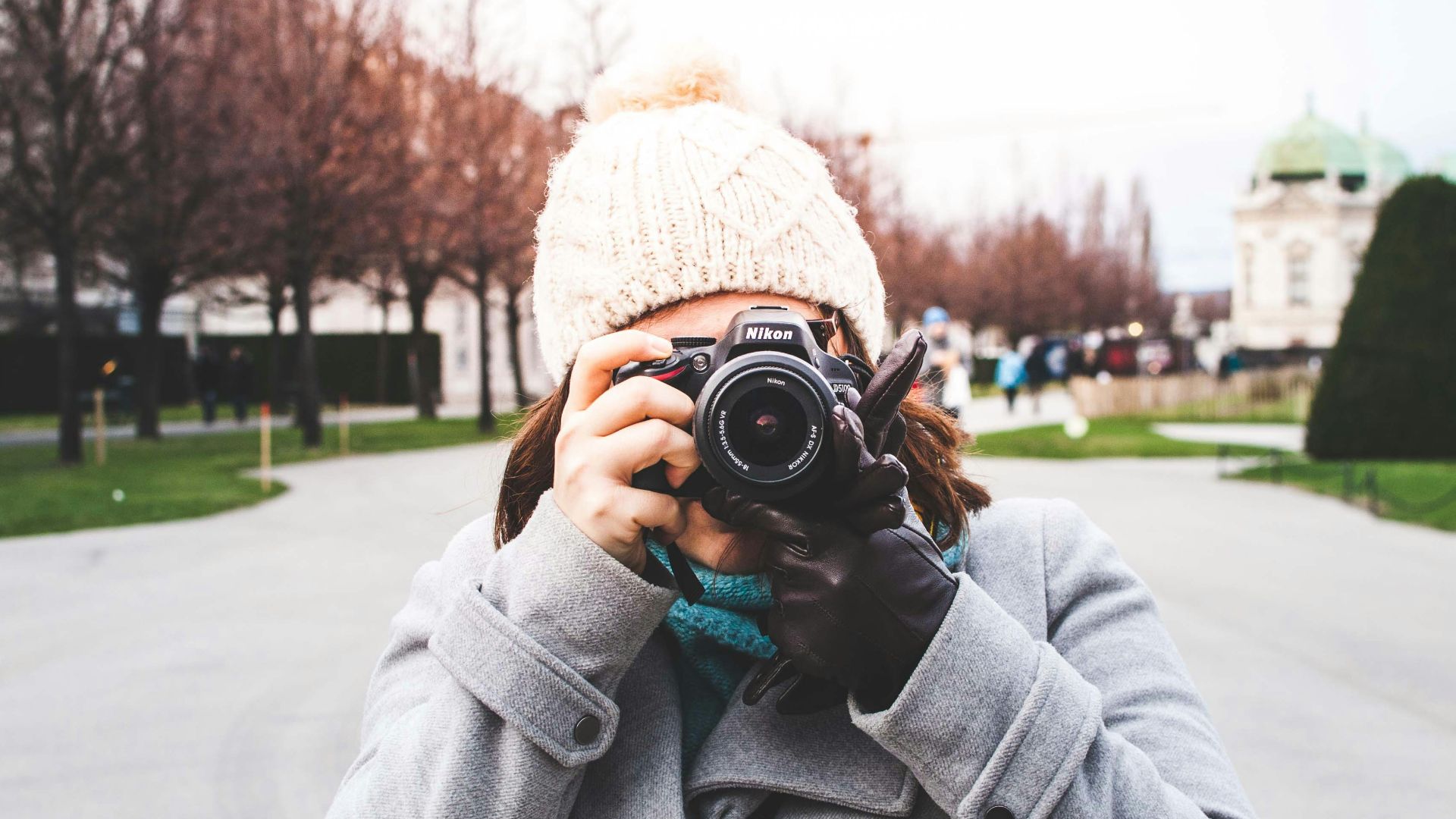 woman holding DSLR camera