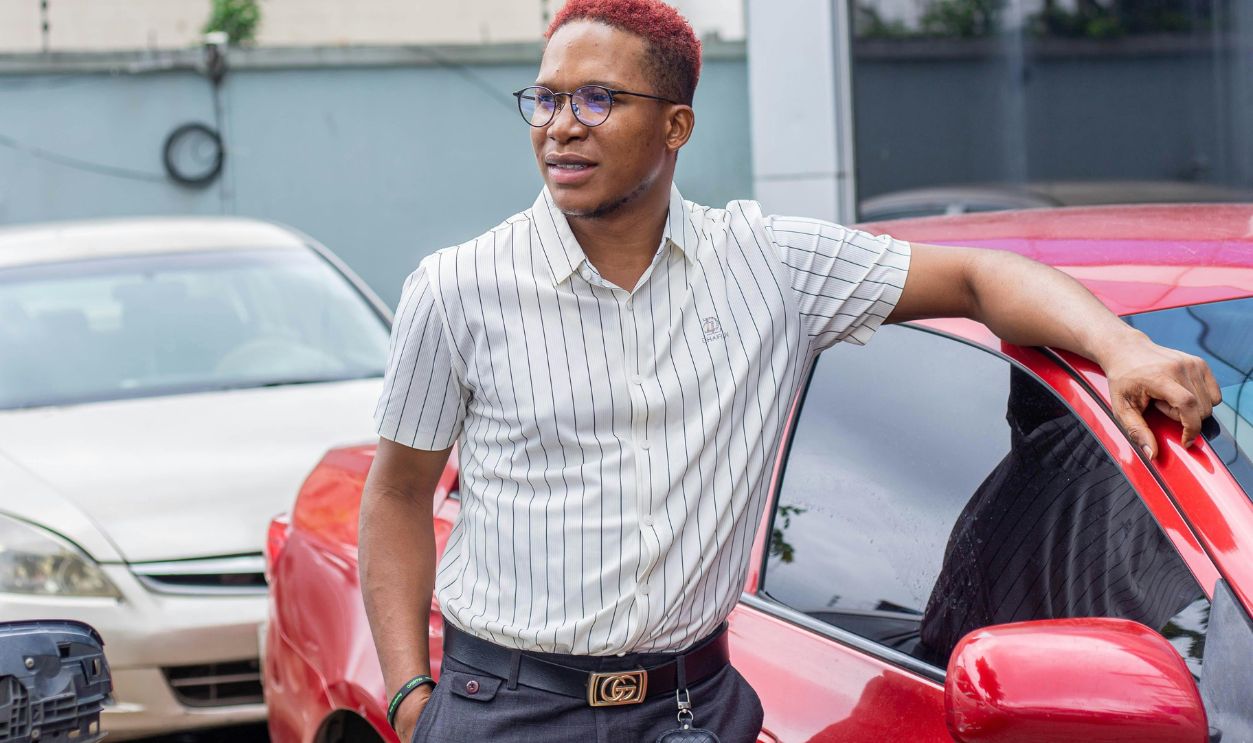 Man Standing by Red Car