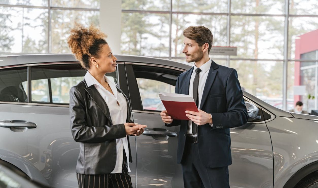 Customer Talking to car Dealer