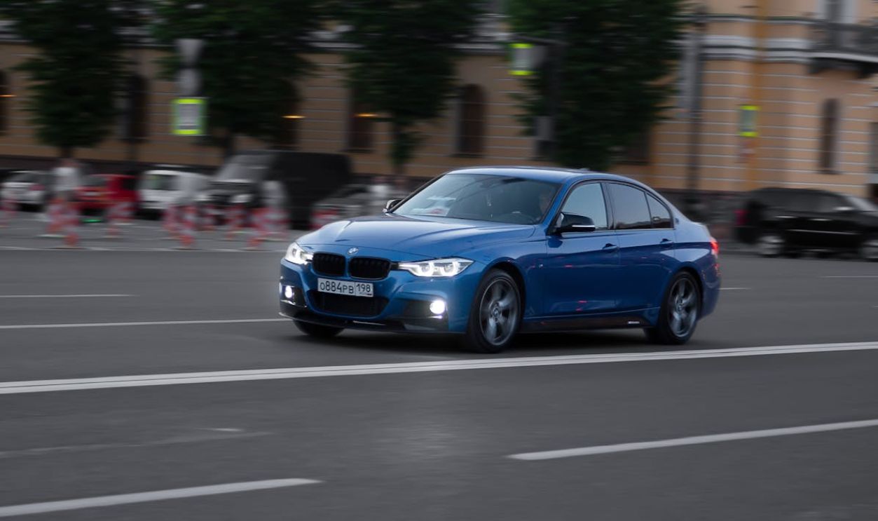 A Blue Car on the Road