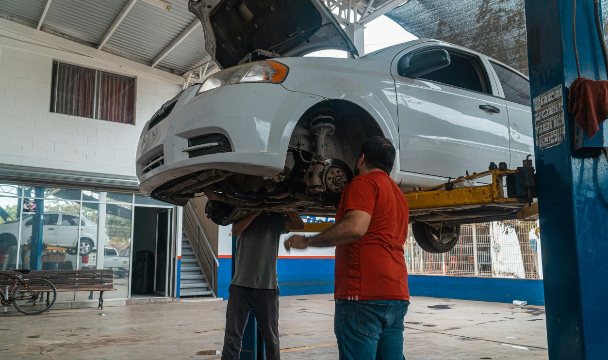 A Man Checking the White Car