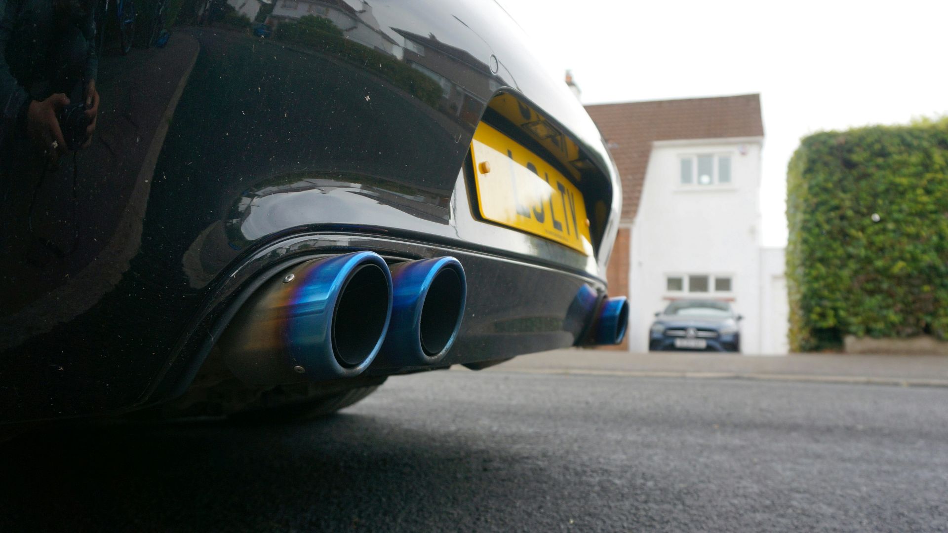 Close-up of blue exhaust pipes on a car.