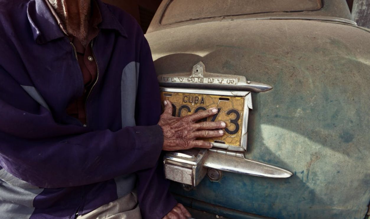 person removing license plate