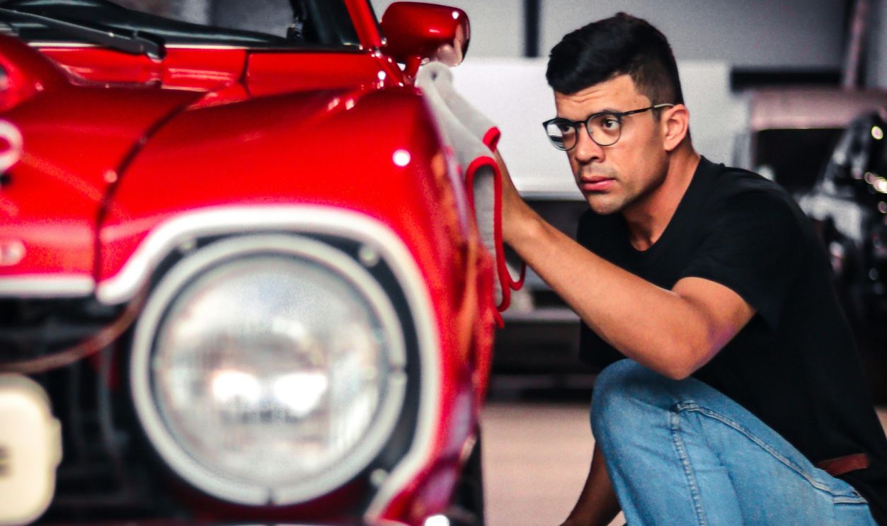 Man Looking at a Vintage Car