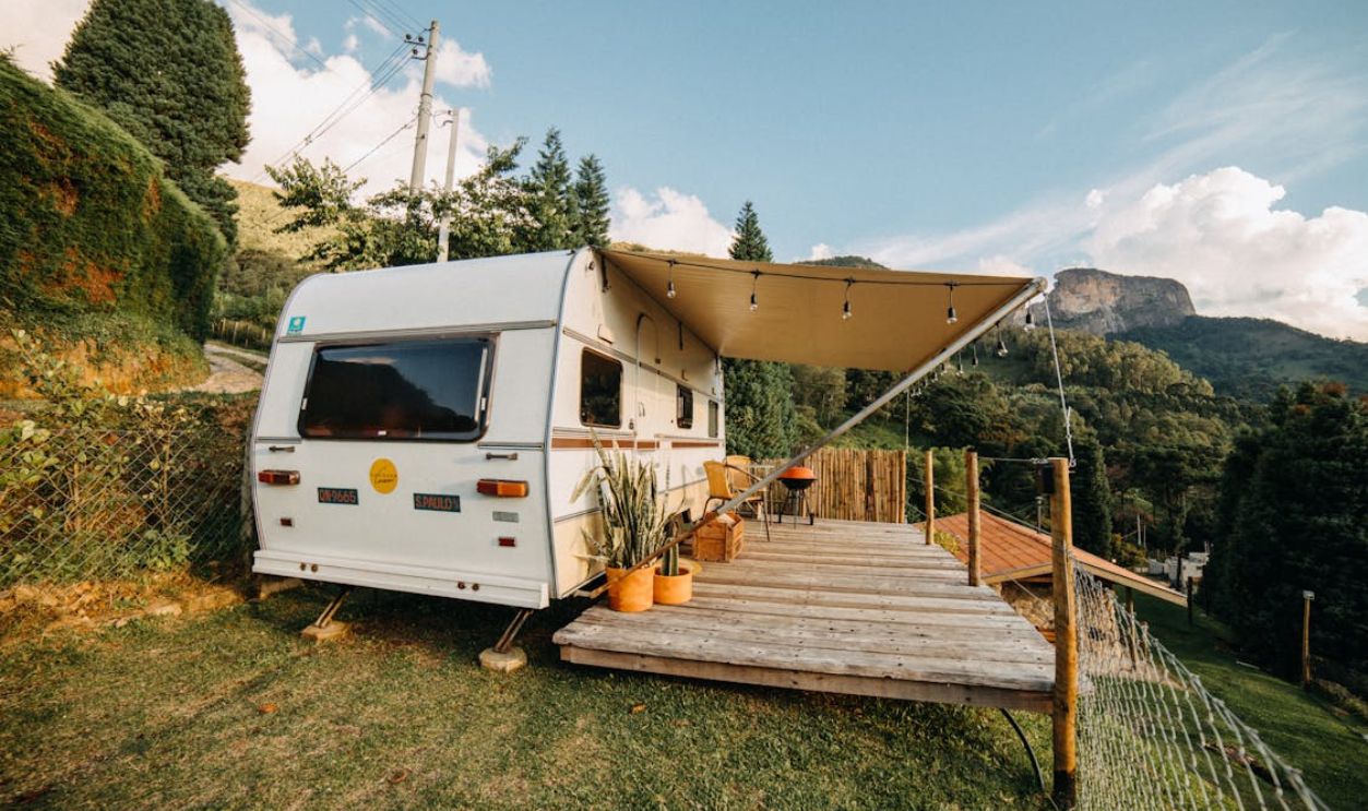 Camper Trailer with an Extension in Mountains