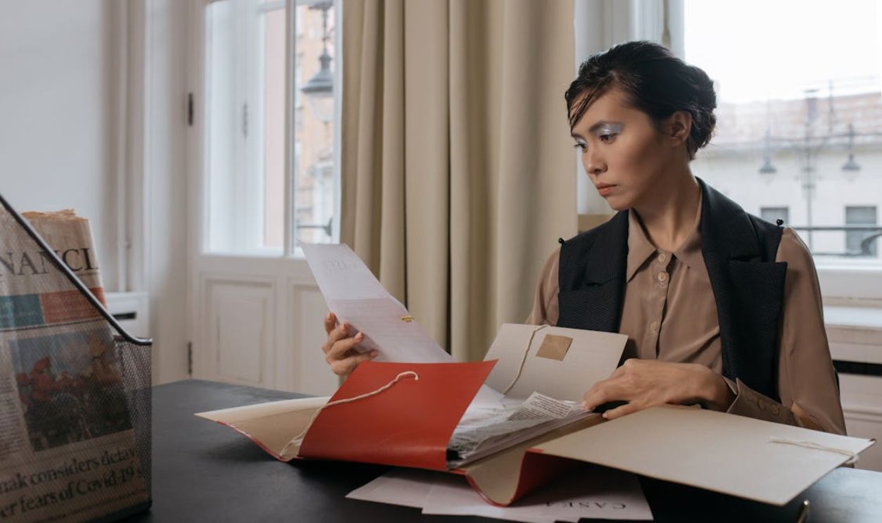 A Woman Holding Documents