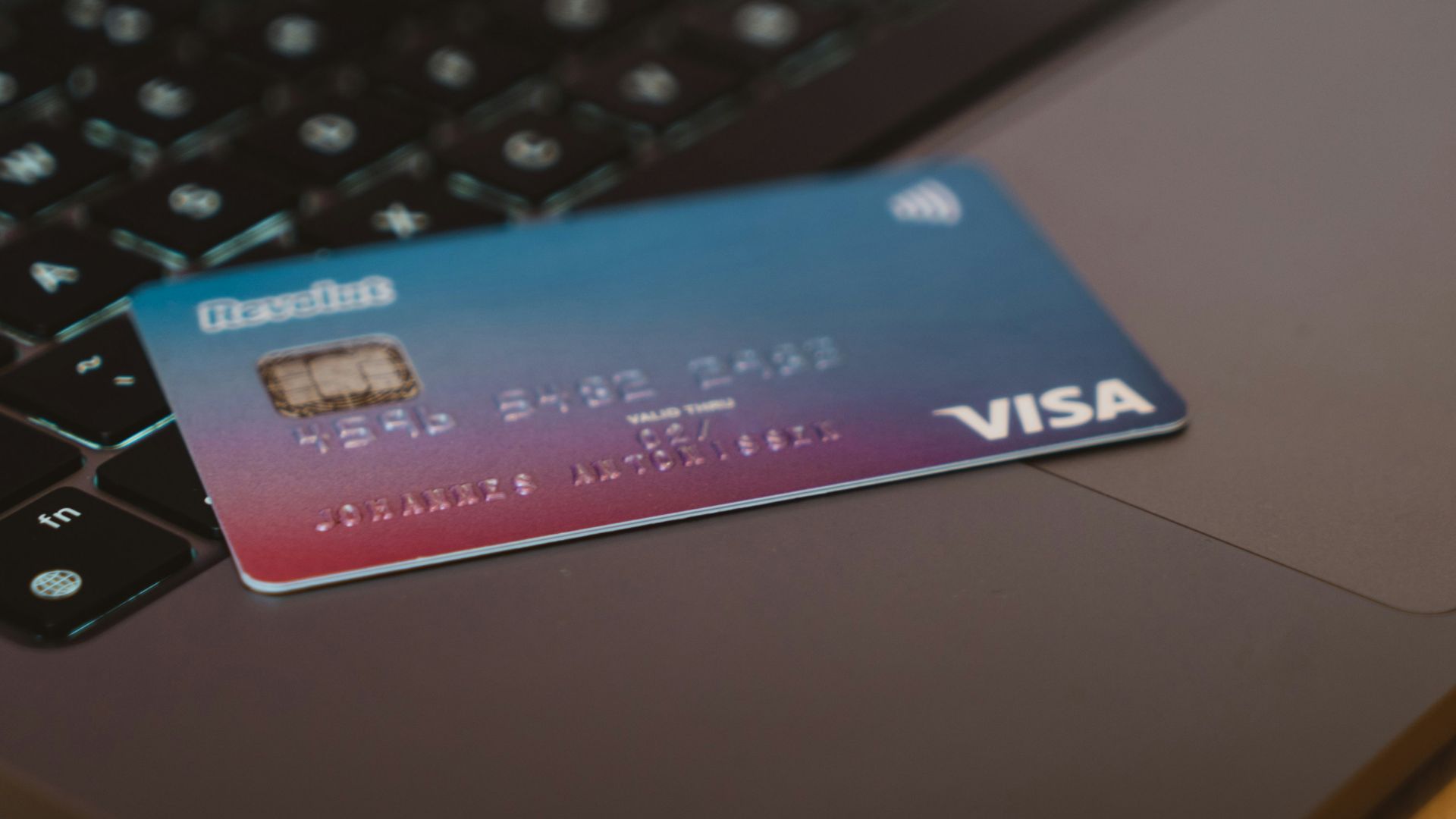 blue and white visa card on silver laptop computer