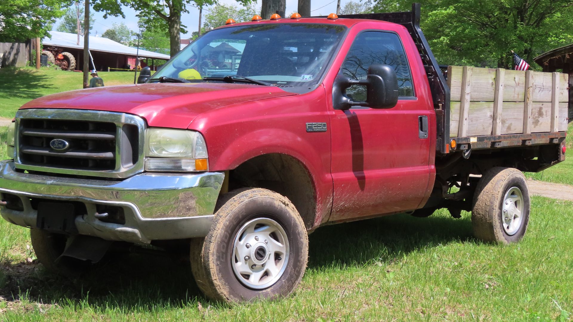 2001 Ford F-250 Super Duty XL regular cab flatbed photographed in Portersville, Pennsylvania. Finished in Toreador Red Clearcoat Metallic.