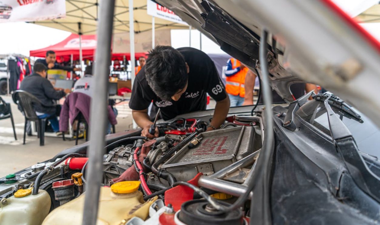 Mechanic Working on Car