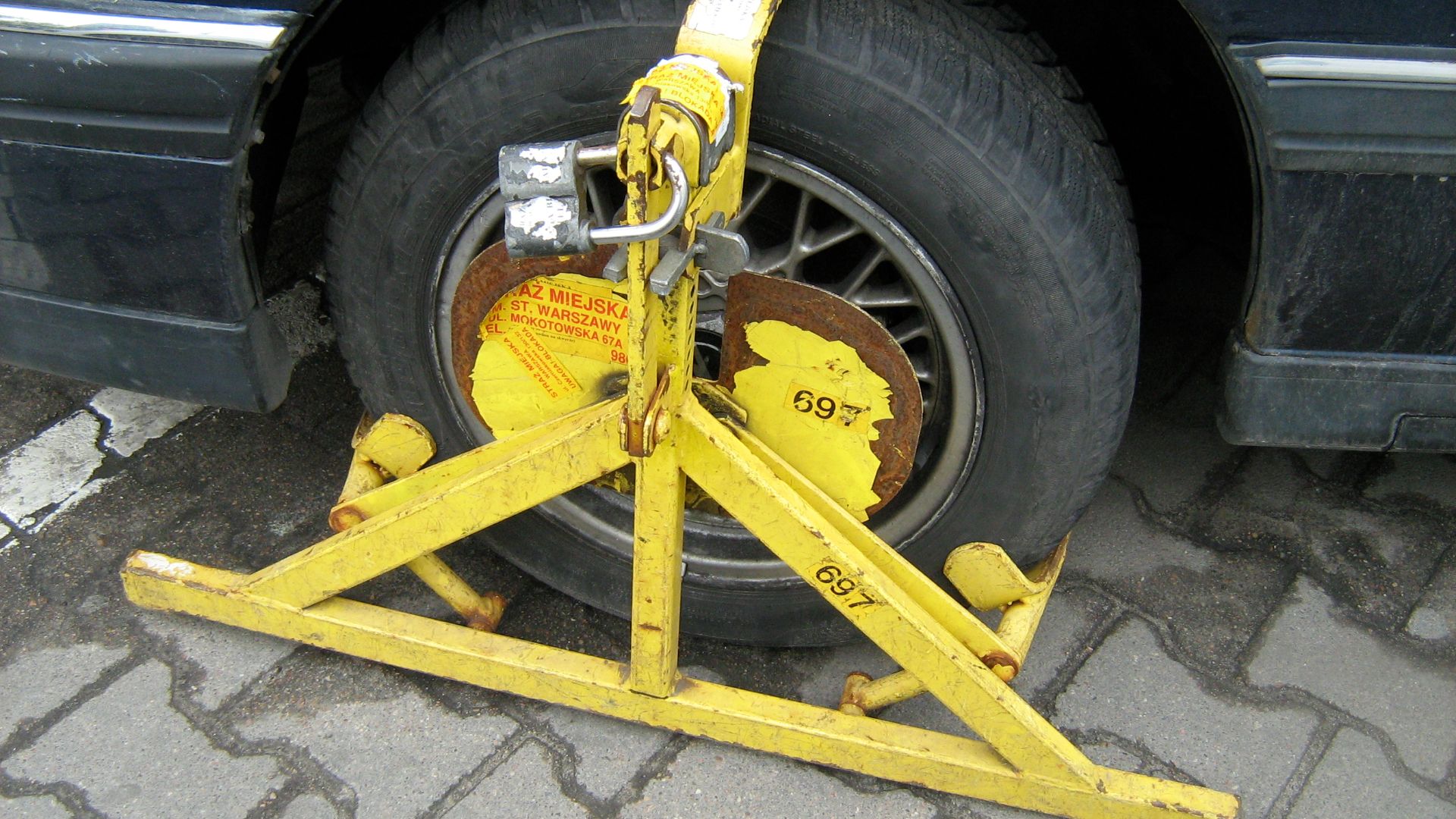 Wheel clamp on an Opel sedan in Warsaw