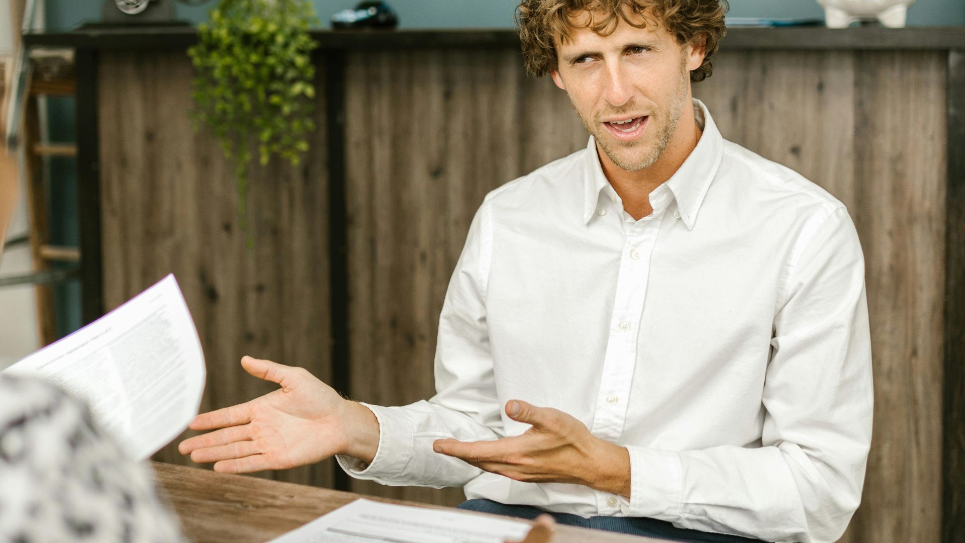 Professional dialogue taking place in a contemporary office environment with emphasis on communication and engagement.