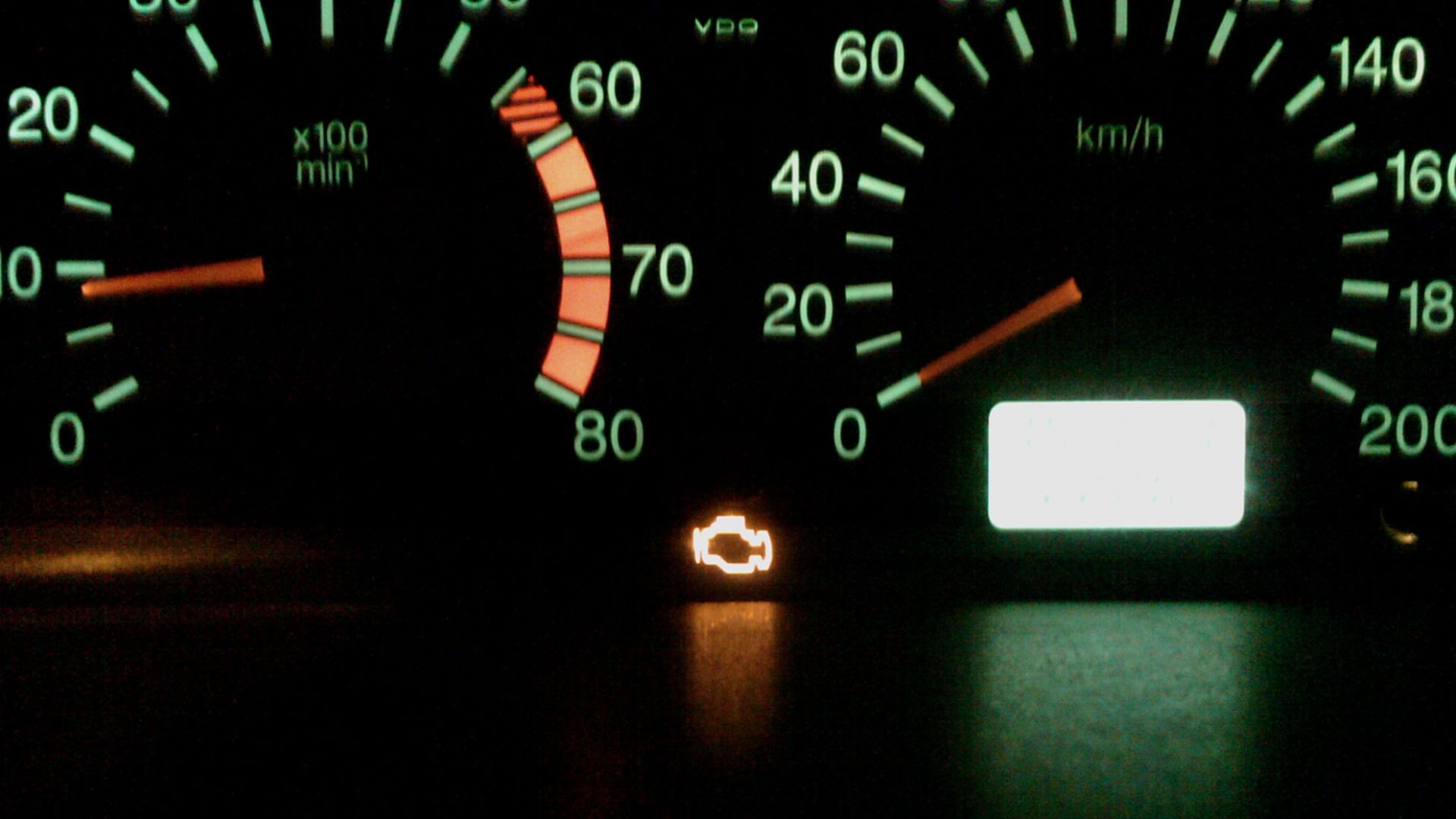 Check Engine lamp on a running engine indicating engine control system malfunction.