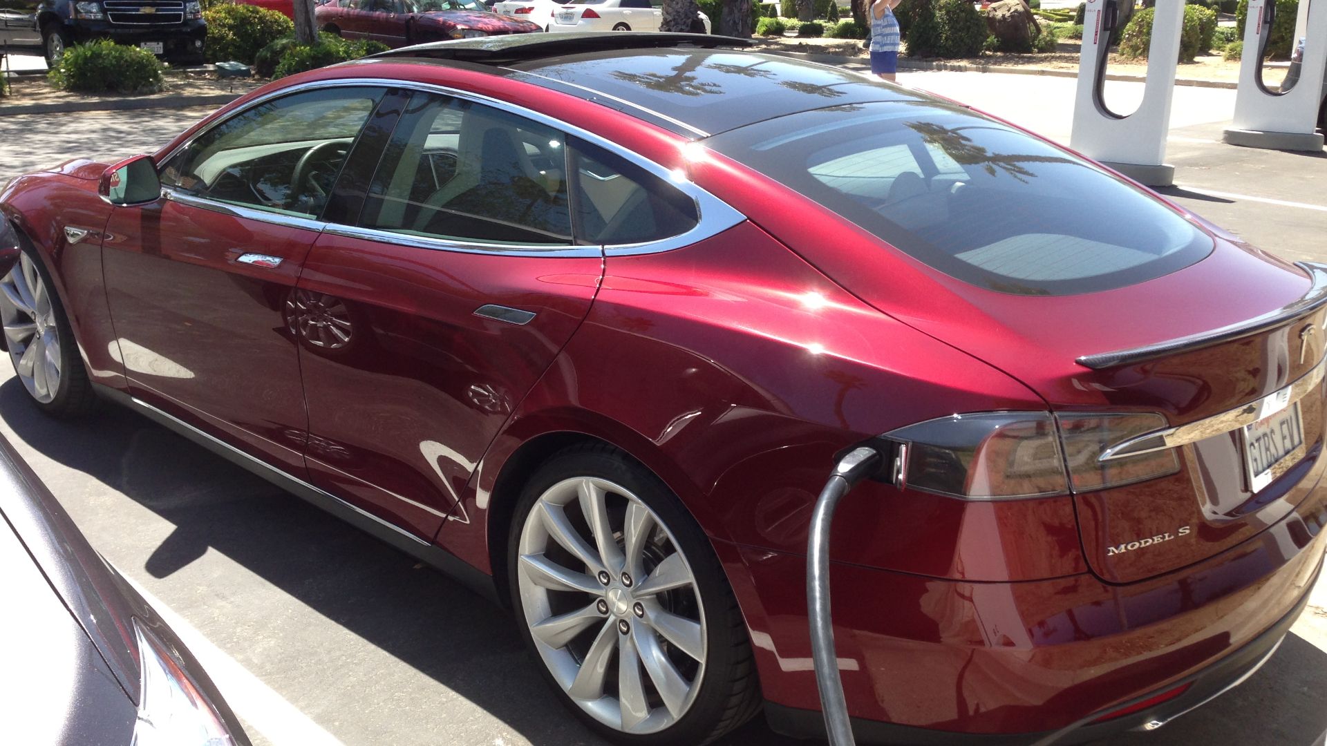 A Tesla Model S connected to a high speed Supercharger station at the Harris Ranch on Interstate 5 in California's Central Valley. The charging is free for Model S owners.