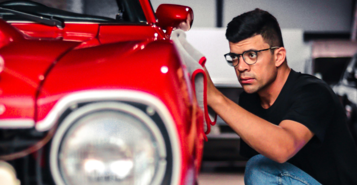 man-looking-at-a-vintage-car