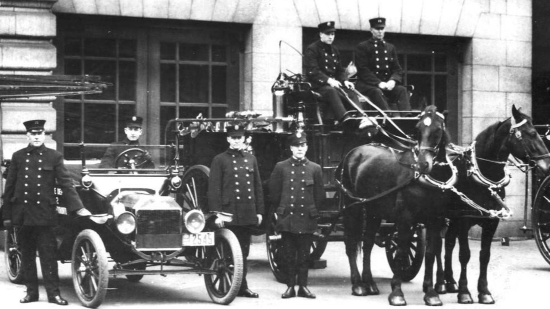 Horse-drawn fire reel and car, Adelaide Street West fire hall, Toronto, Ontario, Canada.